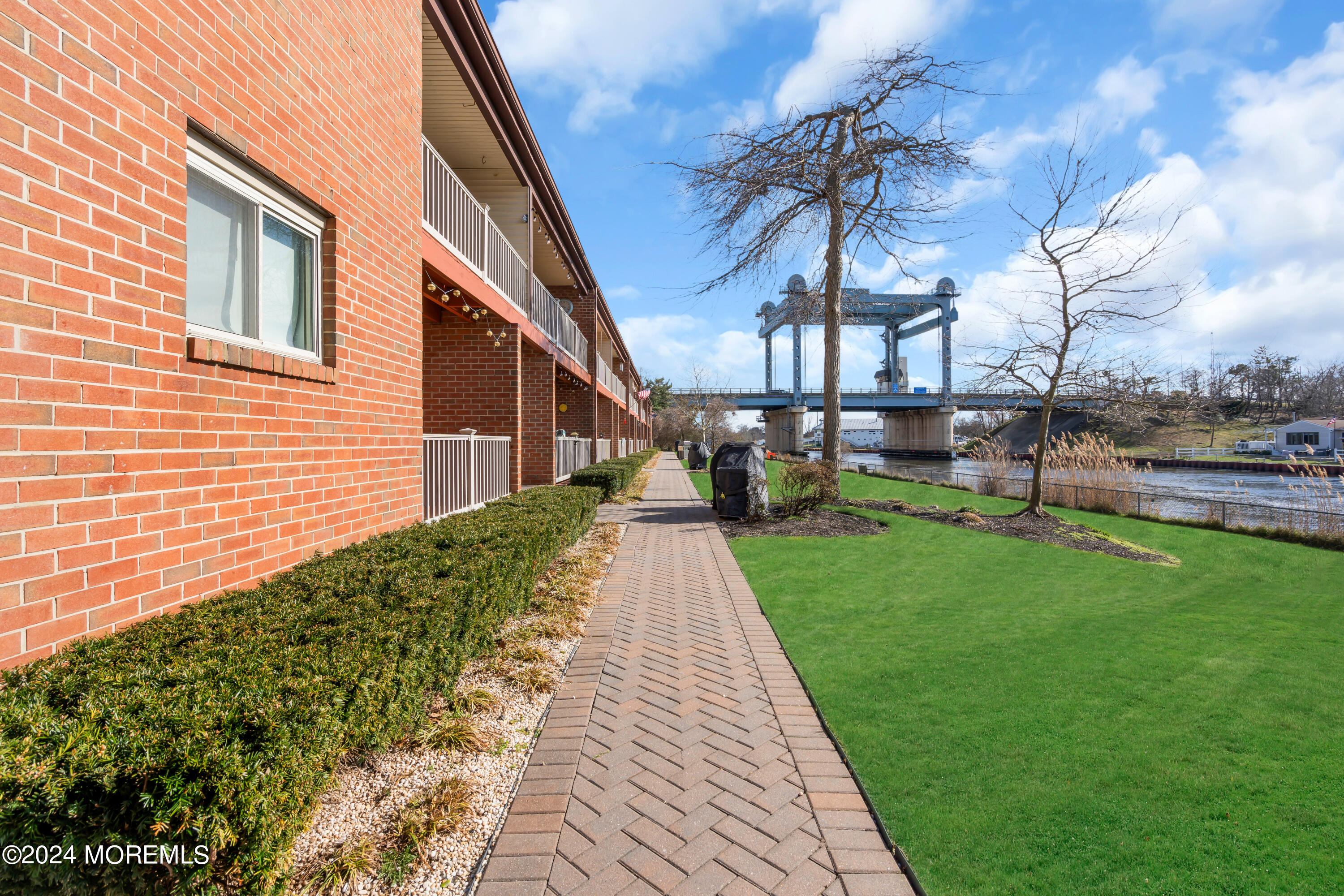 1641 Elm Avenue, Unit 18 Point Pleasant, NJ 08742 - Photo 20 of 23 a front view of a house with a garden