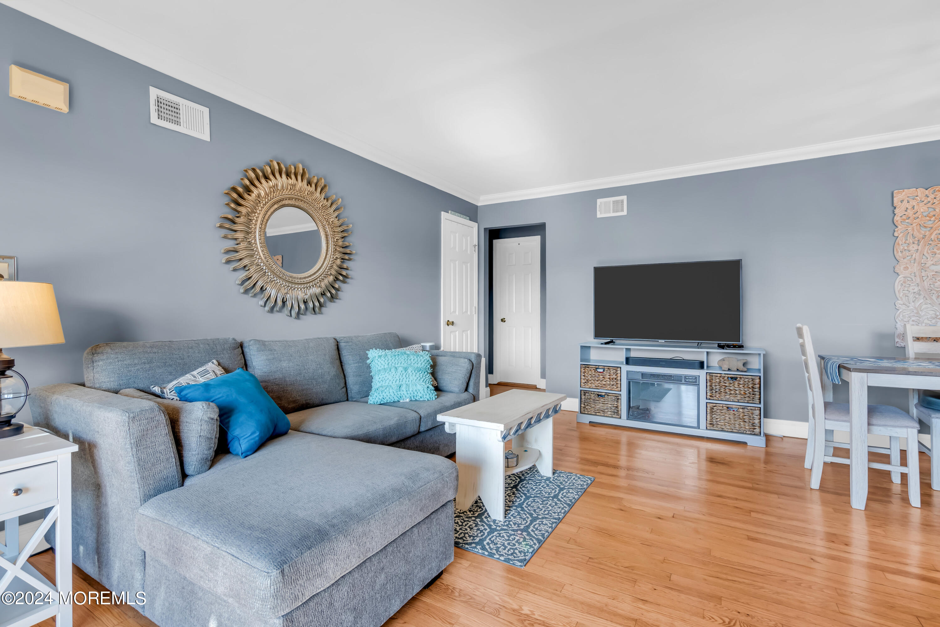 1641 Elm Avenue, Unit 18 Point Pleasant, NJ 08742 - Photo 3 of 23 a living room with furniture and a flat screen tv