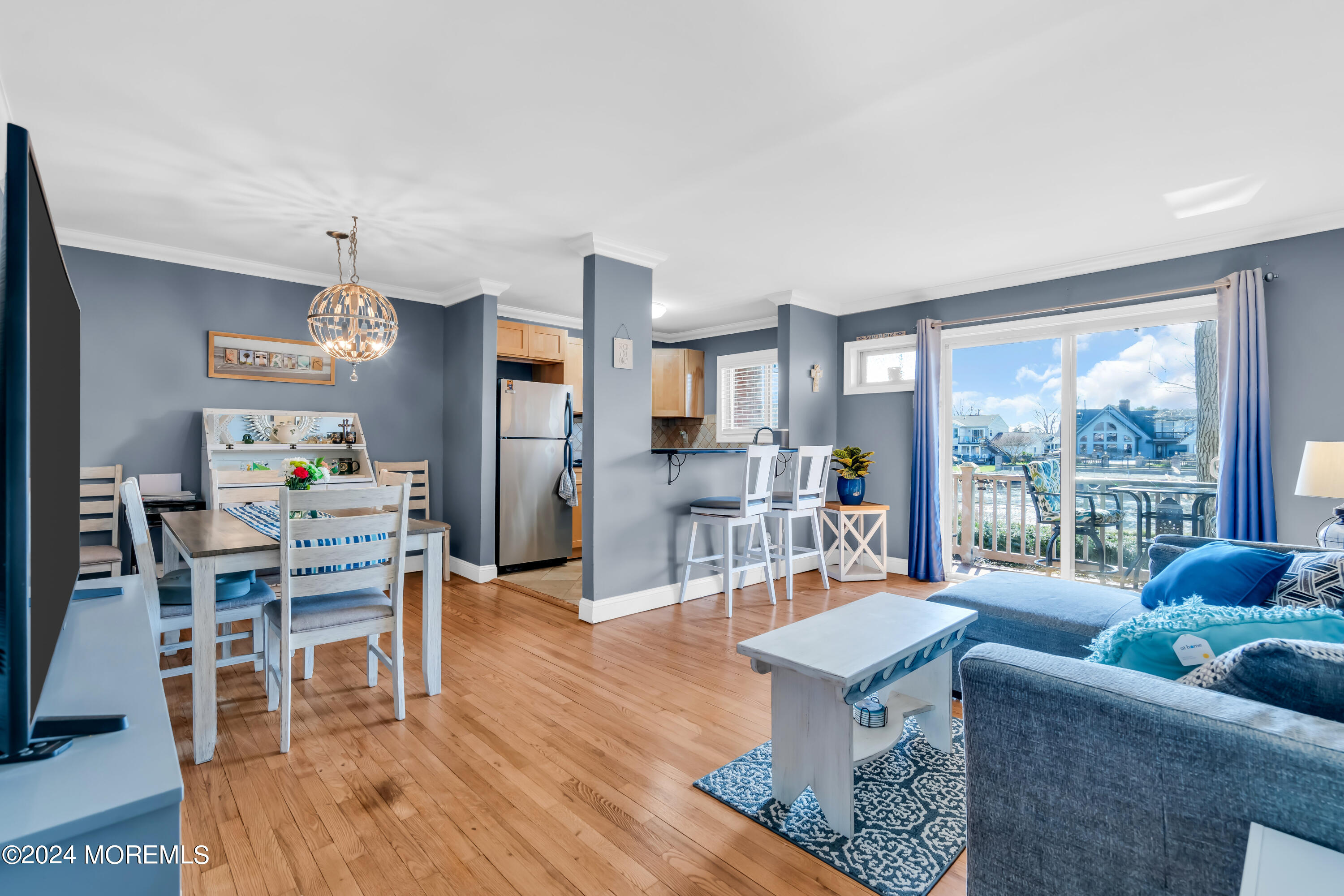 1641 Elm Avenue, Unit 18 Point Pleasant, NJ 08742 - Photo 5 of 23 a living room with furniture a wooden floor and a large window