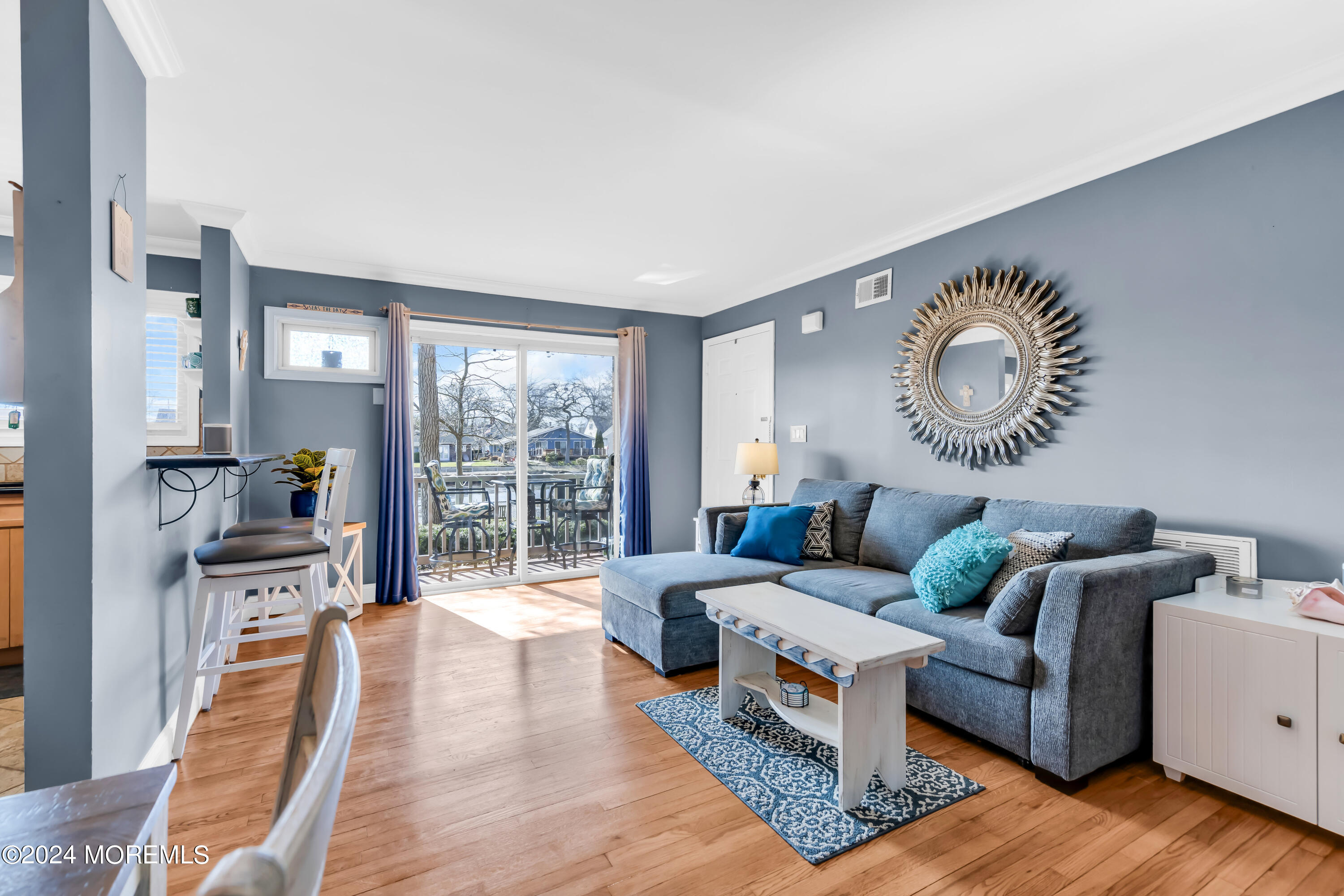 1641 Elm Avenue, Unit 18 Point Pleasant, NJ 08742 - Photo 6 of 23 a living room with furniture and a large window