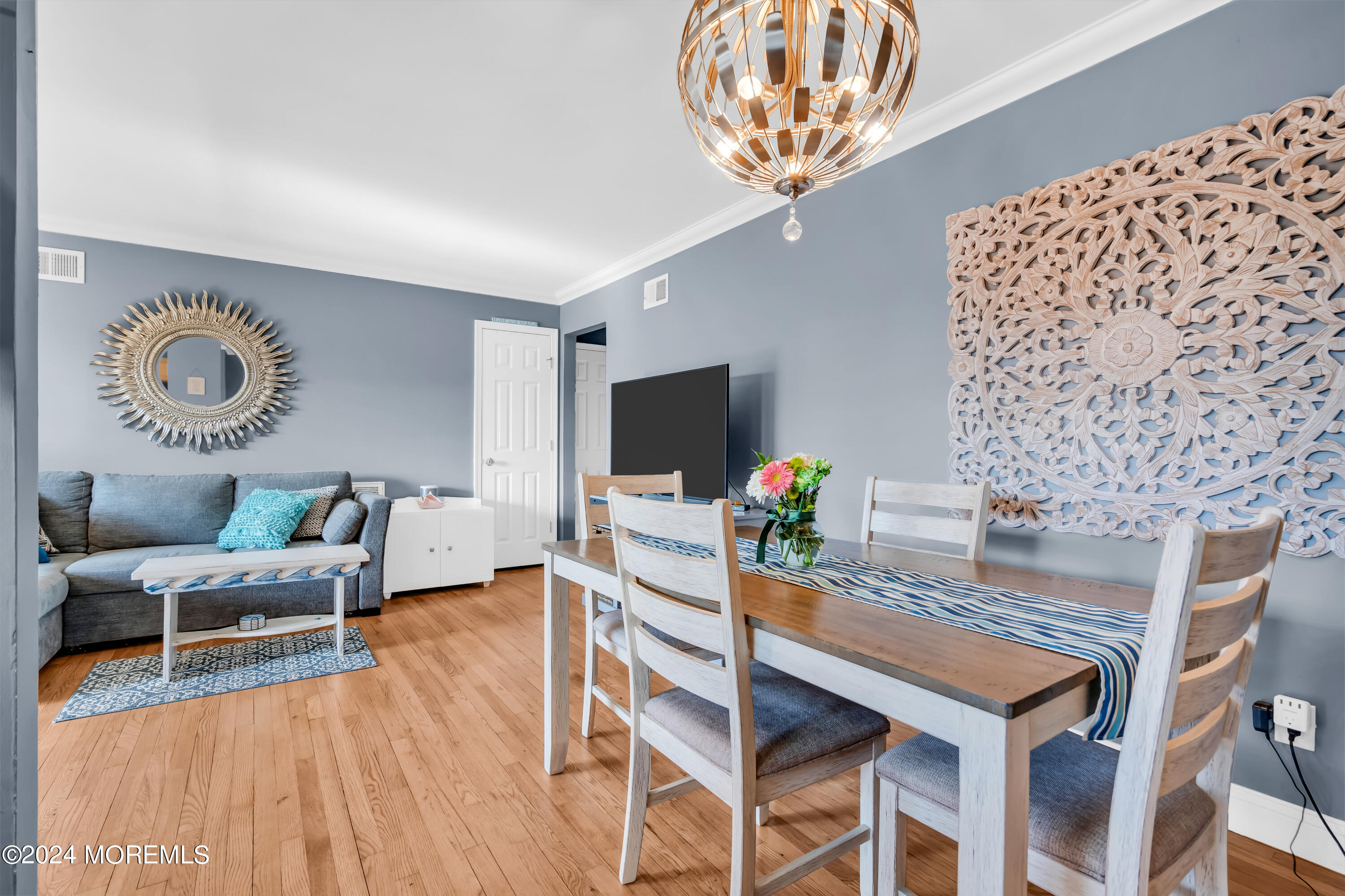 1641 Elm Avenue, Unit 18 Point Pleasant, NJ 08742 - Photo 8 of 23 a dining room with furniture and wooden floor