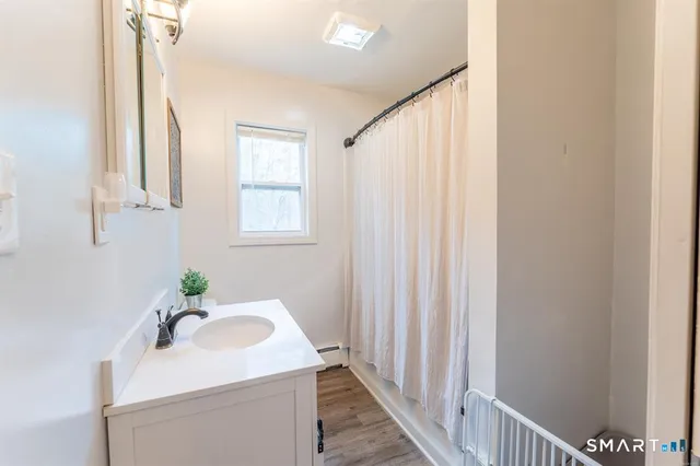 a bathroom with a sink a vanity and a mirror