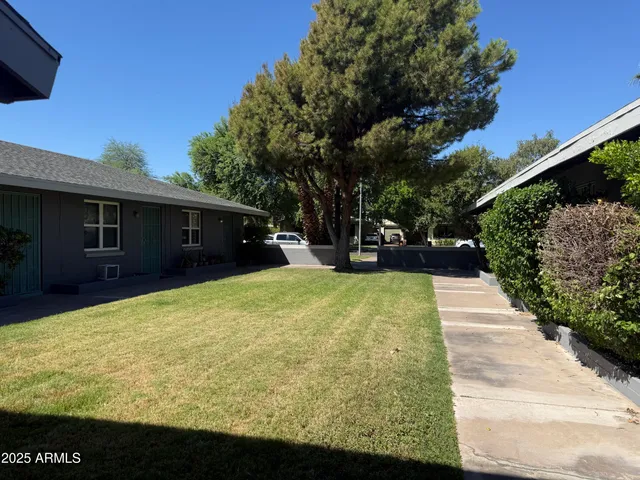 a view of swimming pool with an outdoor seating