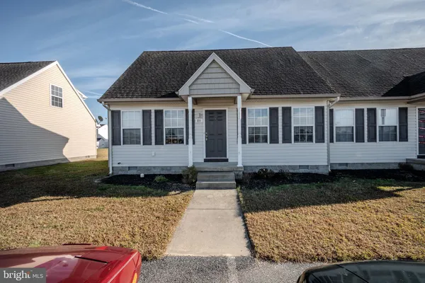 a front view of a house with yard