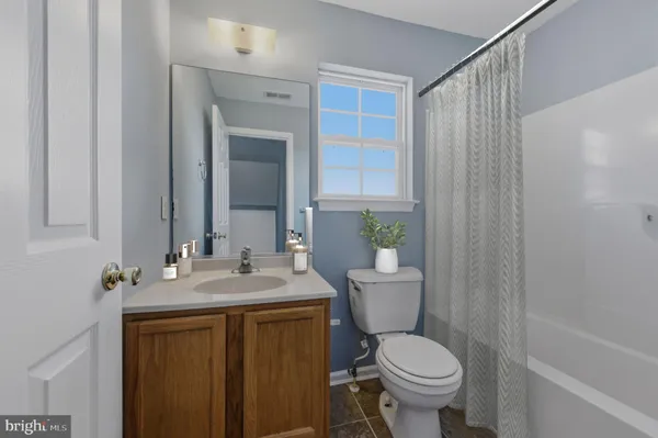 a kitchen with granite countertop a sink cabinets and window