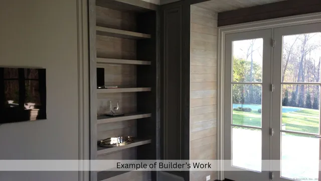 a view of an empty room with wooden shelves