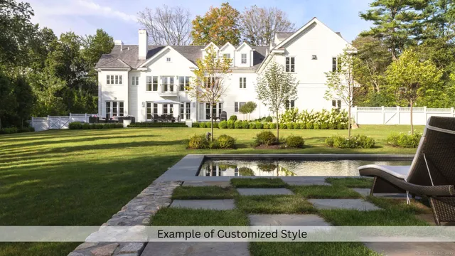 a front view of a house with a yard table and chairs