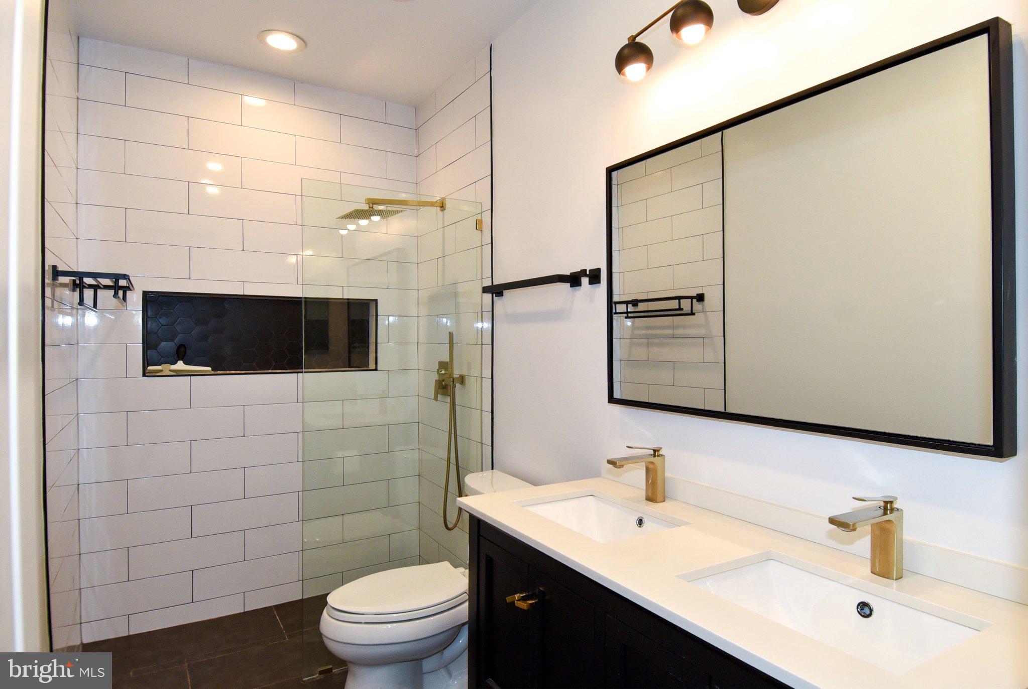 1316 9th Street Northwest Washington, DC 20001 - Photo 18 of 44 Sleek modern bathroom with elegance.