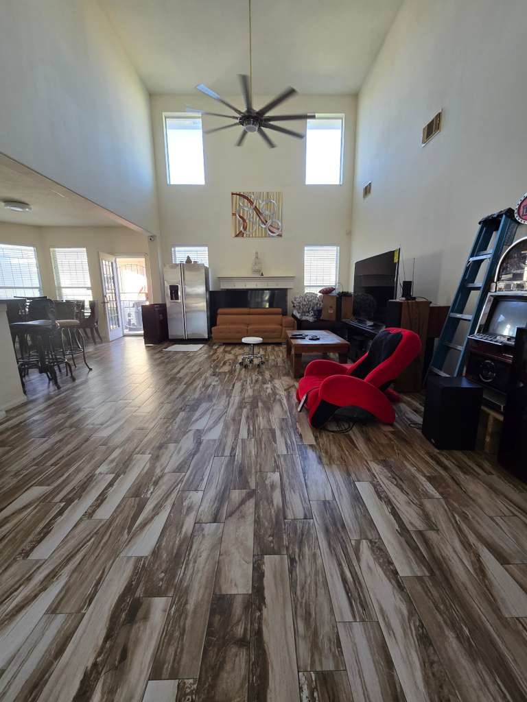 13906 Winter Rose Way Houston, TX 77083 - Photo 12 of 29 Spacious living area with an open layout, providing a comfortable space for relaxing or entertaining guests.