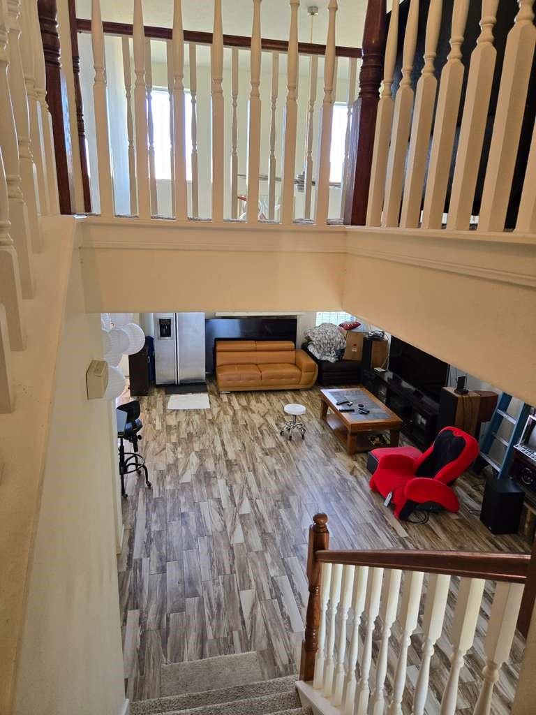 13906 Winter Rose Way Houston, TX 77083 - Photo 15 of 29 Spacious living area with an open layout, providing a comfortable space for relaxing or entertaining guests.