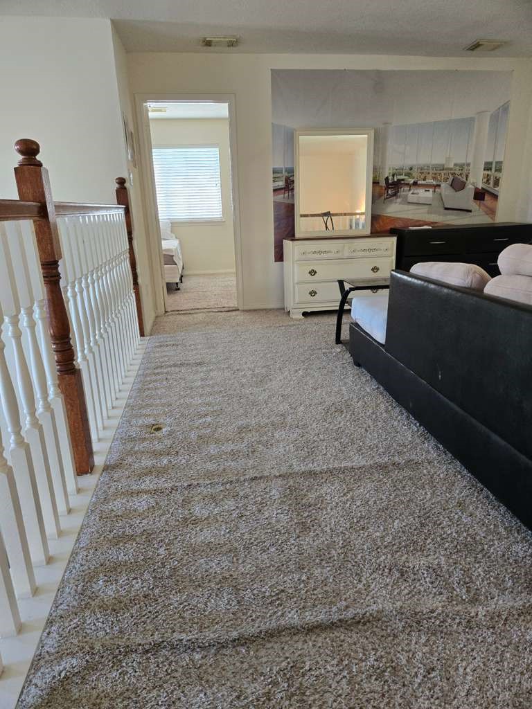 13906 Winter Rose Way Houston, TX 77083 - Photo 18 of 29 Spacious living area with an open layout, providing a comfortable space for relaxing or entertaining guests.