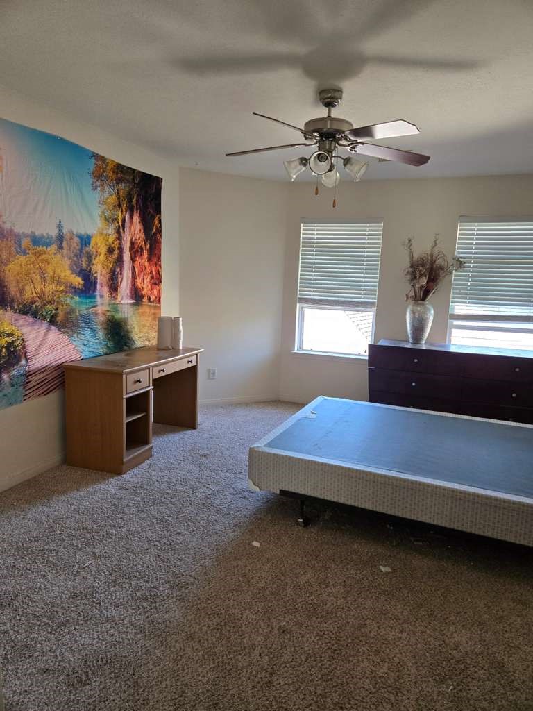 13906 Winter Rose Way Houston, TX 77083 - Photo 19 of 29 Private primary bedroom offering a comfortable retreat with sufficient space for furnishings and personal touches.