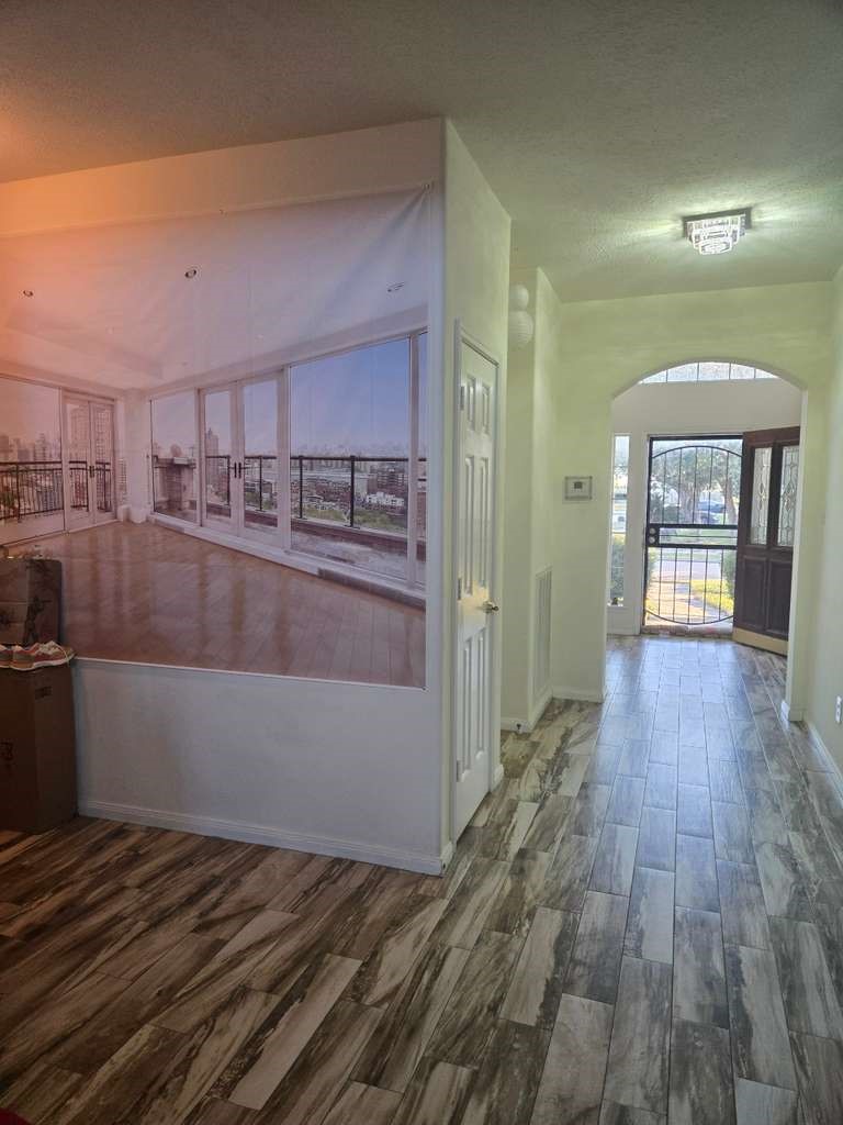 13906 Winter Rose Way Houston, TX 77083 - Photo 6 of 29 Spacious living area with an open layout, providing a comfortable space for relaxing or entertaining guests.