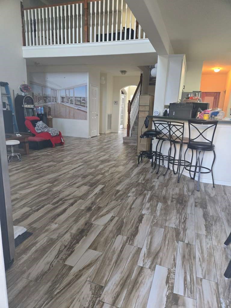 13906 Winter Rose Way Houston, TX 77083 - Photo 10 of 29 Spacious living area with an open layout, providing a comfortable space for relaxing or entertaining guests.
