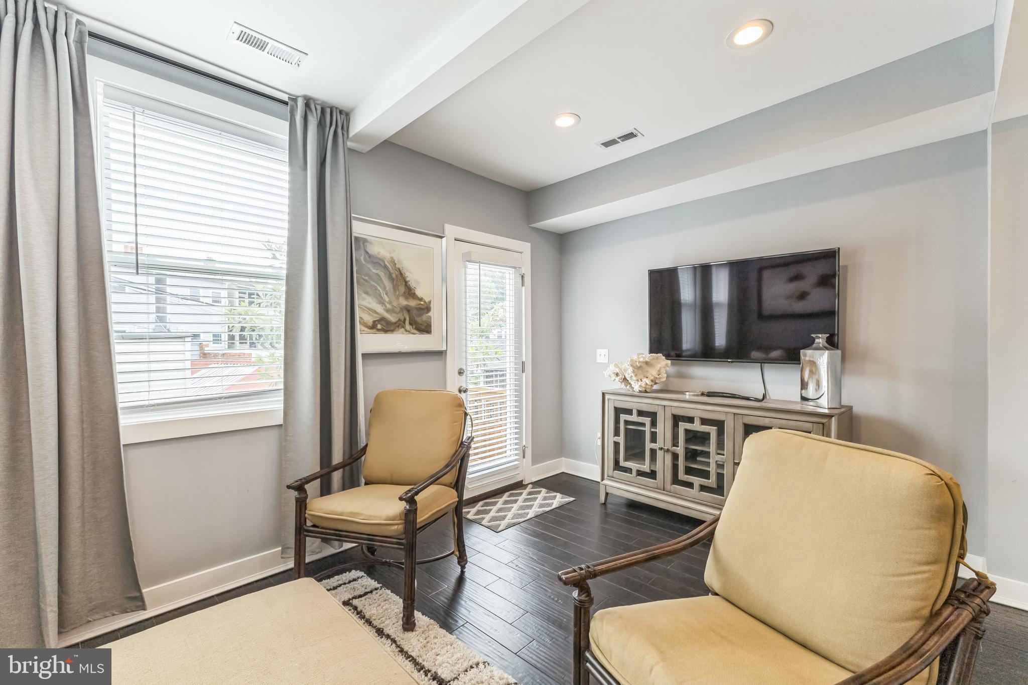 5623 Kansas Avenue Northwest Washington, DC 20011 - Photo 14 of 32 a living room with furniture flat screen tv and window