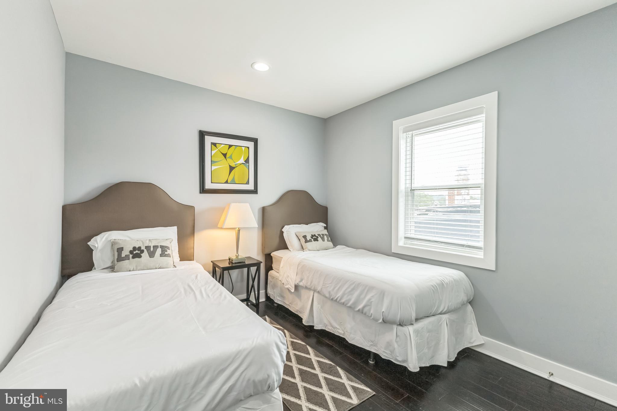 5623 Kansas Avenue Northwest Washington, DC 20011 - Photo 21 of 32 a bedroom with two beds and a window