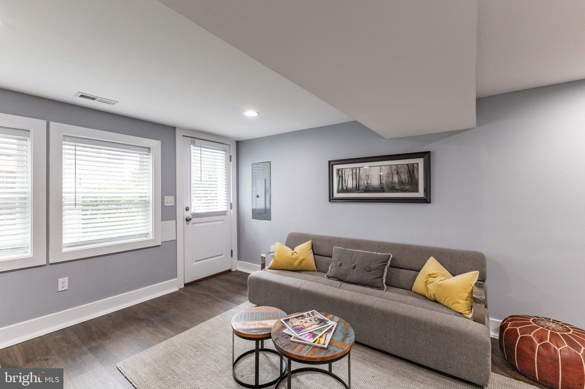 5623 Kansas Avenue Northwest Washington, DC 20011 - Photo 23 of 32 a living room with furniture and a window