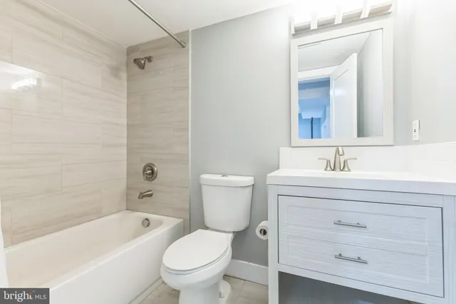 a bathroom with a sink a toilet and a bathtub
