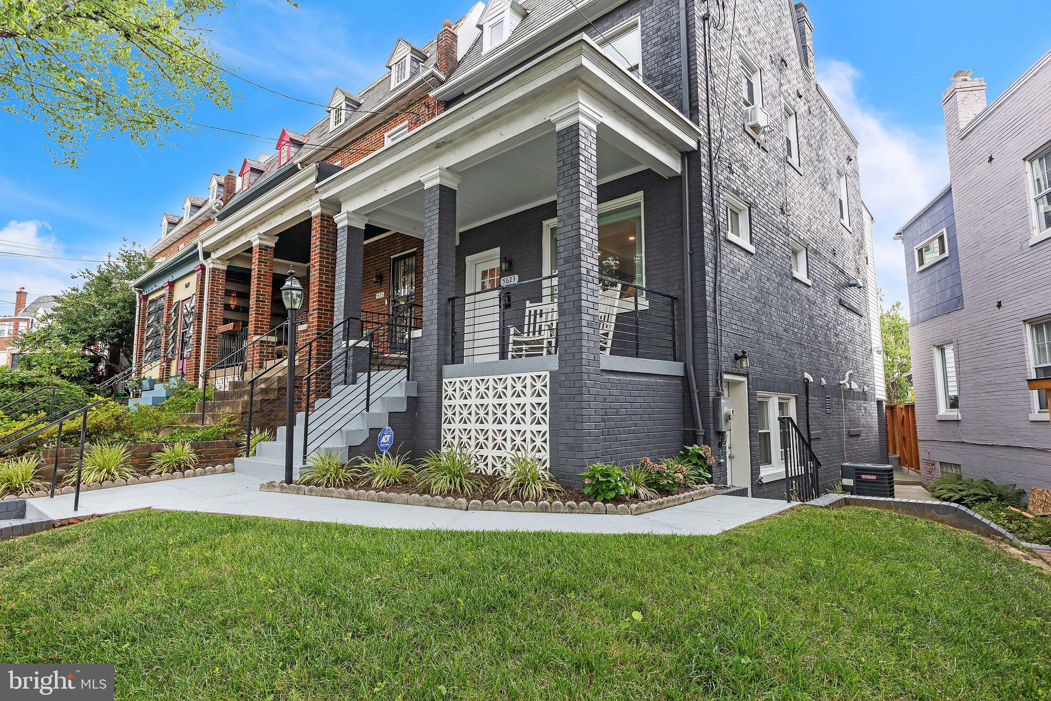5623 Kansas Avenue Northwest Washington, DC 20011 - Photo 3 of 32 front view of a house with a yard