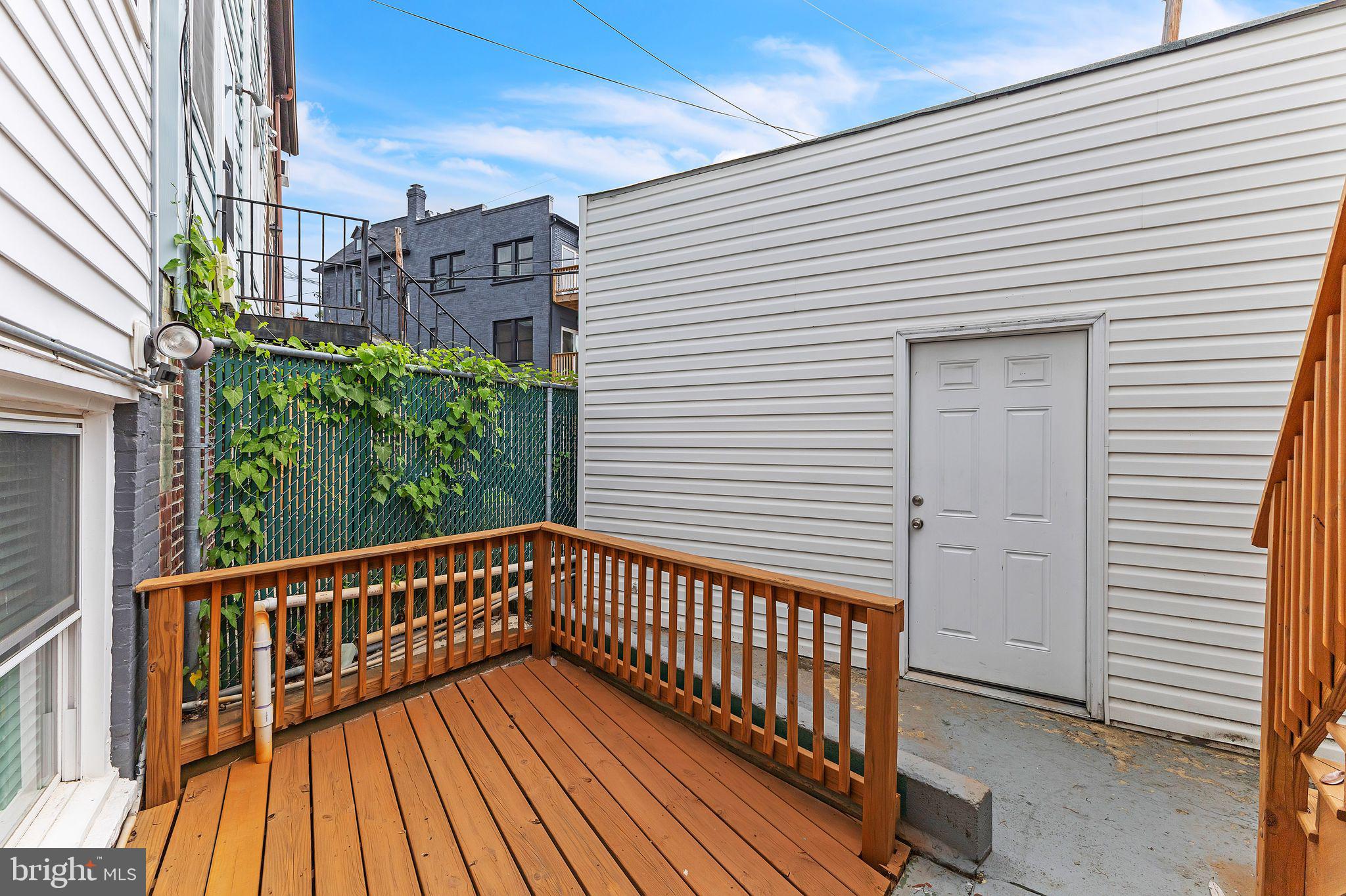5623 Kansas Avenue Northwest Washington, DC 20011 - Photo 31 of 32 a view of a balcony with wooden floor