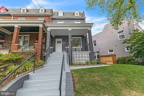 front view of a house with a small yard
