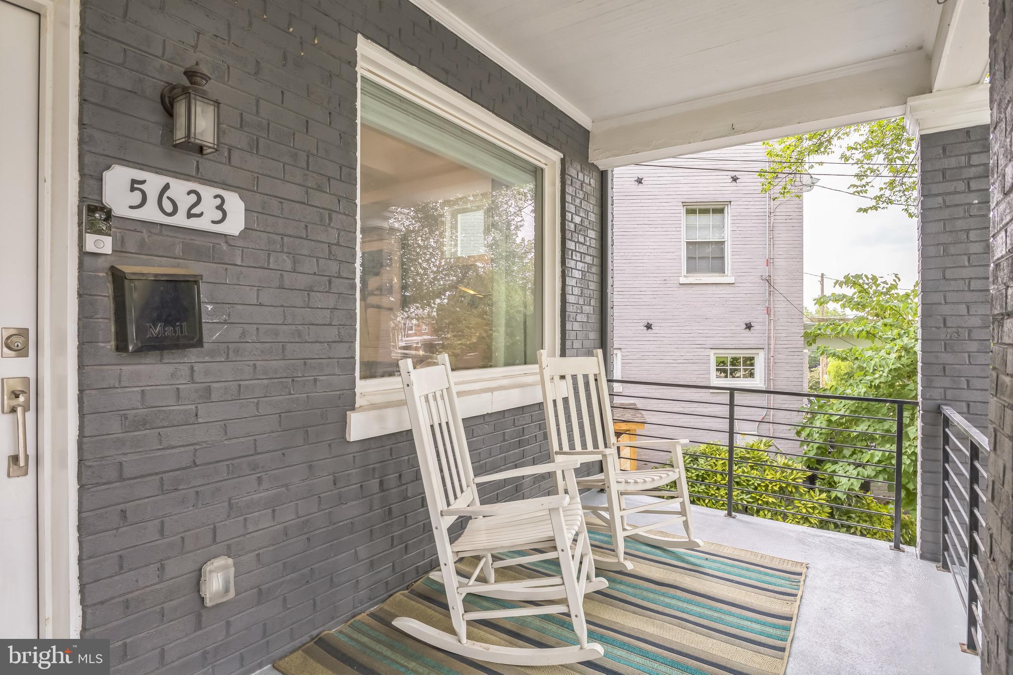 5623 Kansas Avenue Northwest Washington, DC 20011 - Photo 6 of 32 a view of a porch with a table and chairs