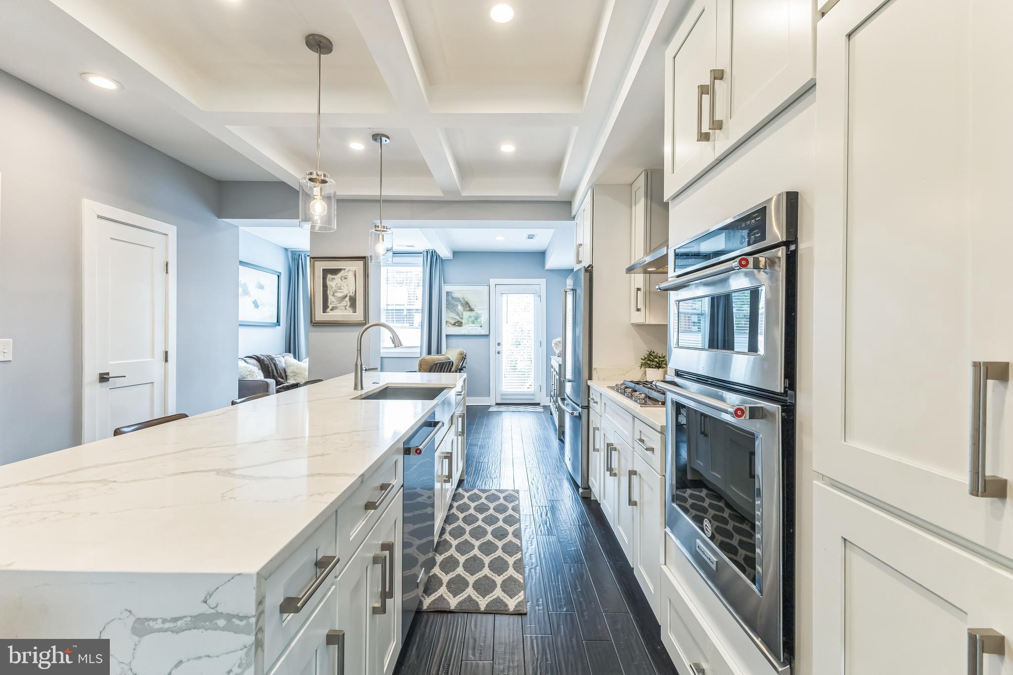 5623 Kansas Avenue Northwest Washington, DC 20011 - Photo 10 of 32 an open kitchen with a sink and stainless steel appliances