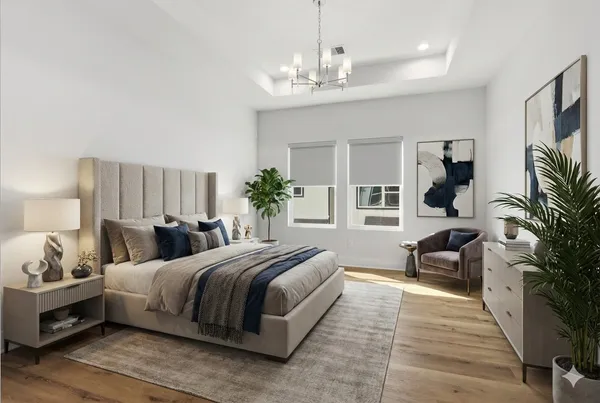 a bedroom with bed and a chandelier