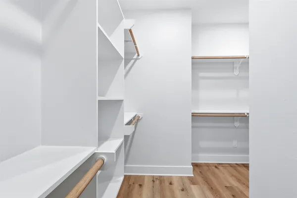 a view of an empty walk in closet