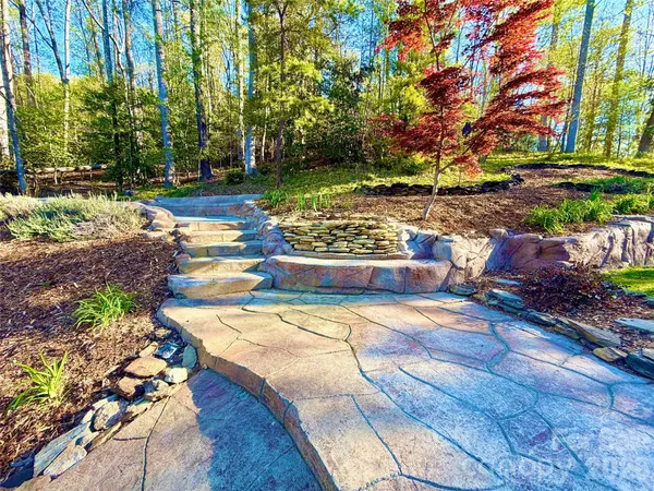 a view of a swimming pool with a table and chairs