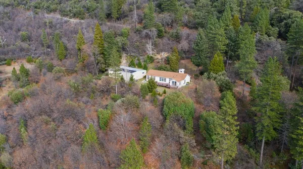 an aerial view of residential house with outdoor space