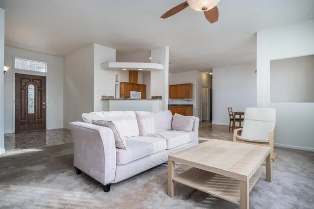 a living room with furniture and a rug
