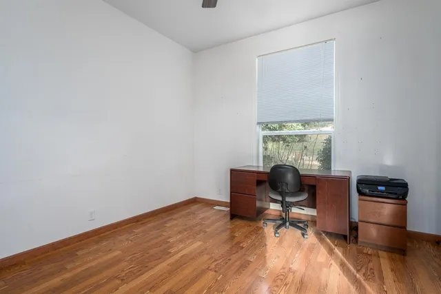 a workspace with furniture and a window