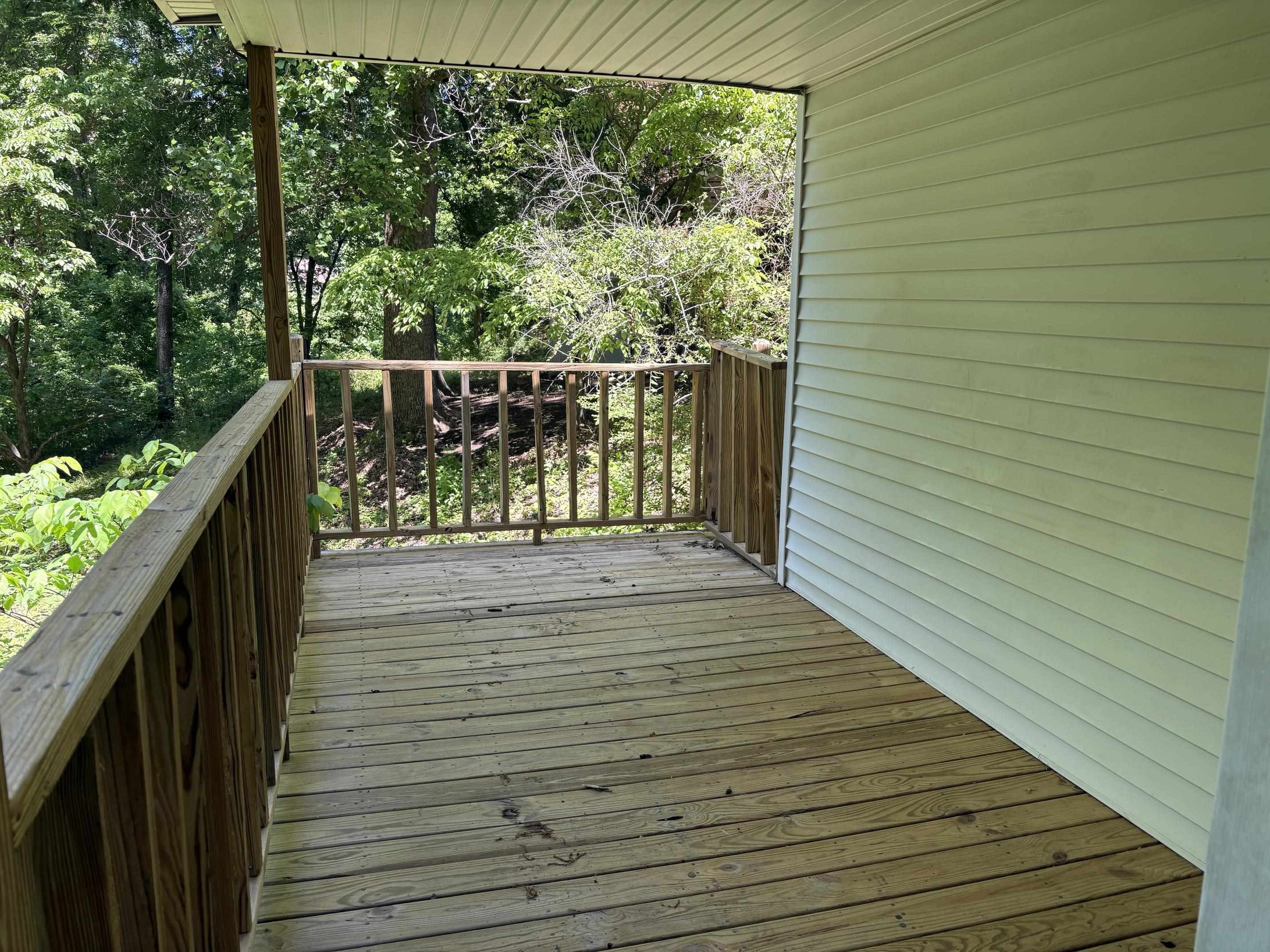 146 Walker Street Ripley, TN 38063 - Photo 13 of 14 a balcony with wooden floor