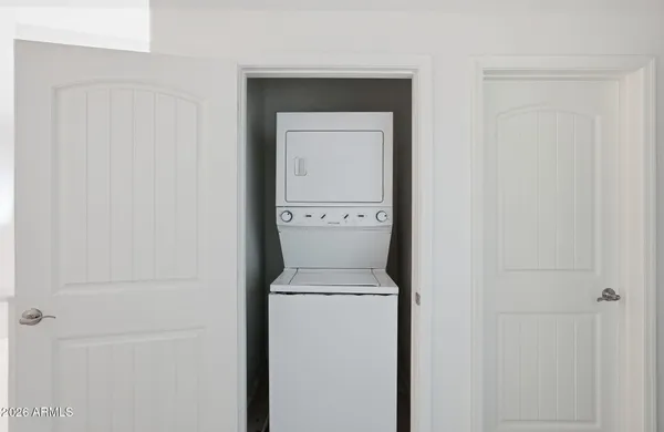 a view of a hallway with washer and dryer
