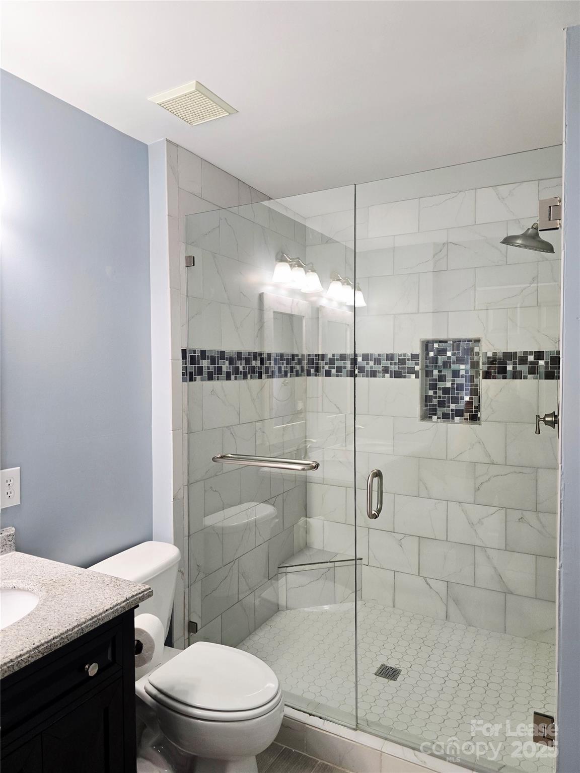 19025 Coachmans Trace Cornelius, NC 28031 - Photo 19 of 34 a bathroom with a shower a toilet and sink