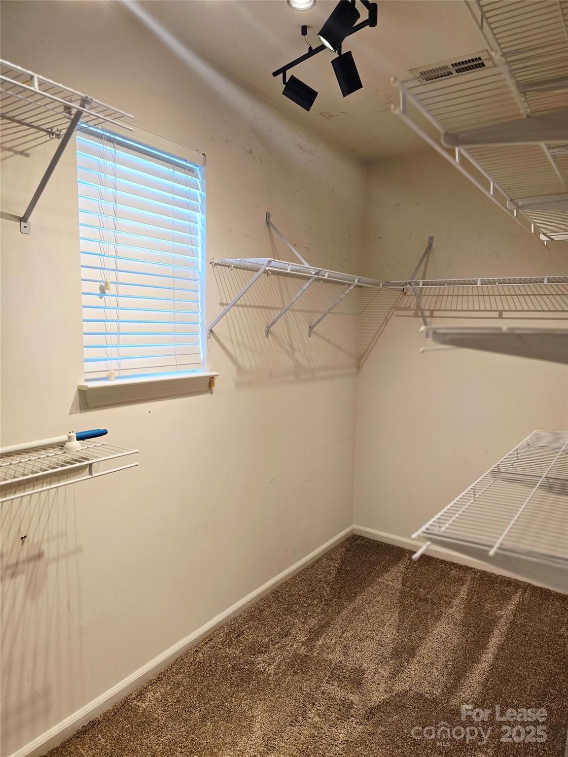 19025 Coachmans Trace Cornelius, NC 28031 - Photo 22 of 34 a view of a room with racks on the wall