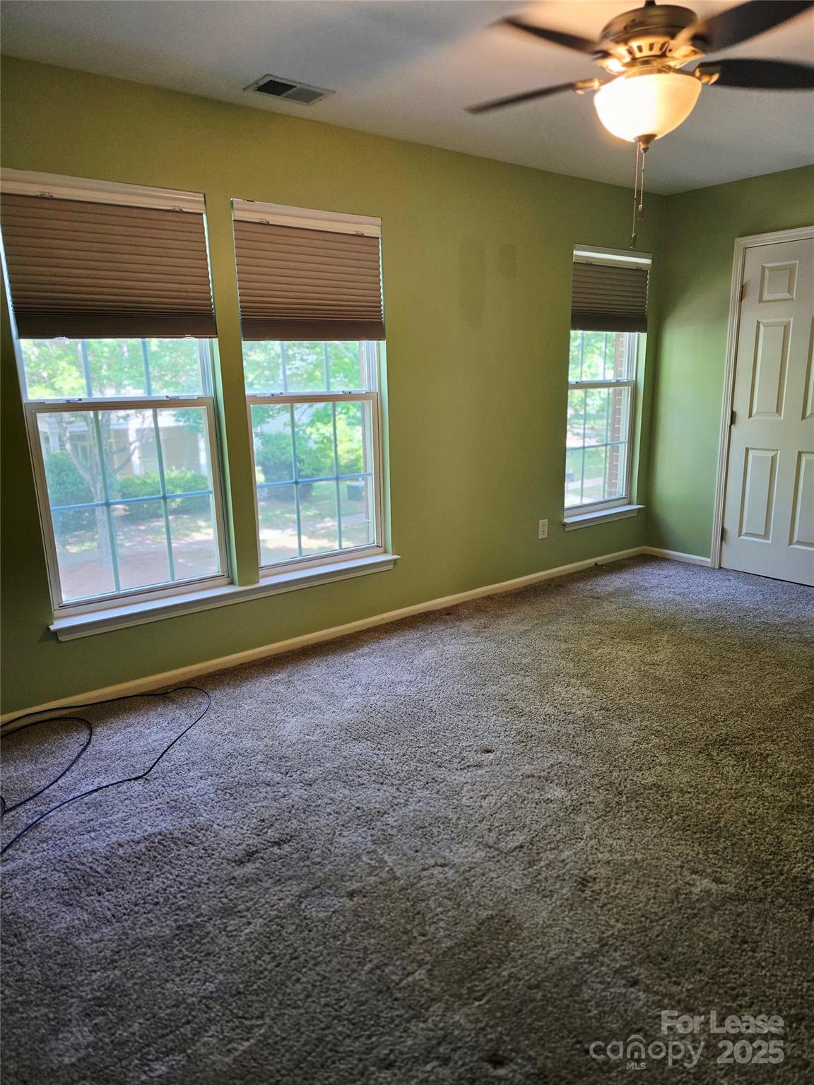 19025 Coachmans Trace Cornelius, NC 28031 - Photo 24 of 34 a view of an empty room with a window