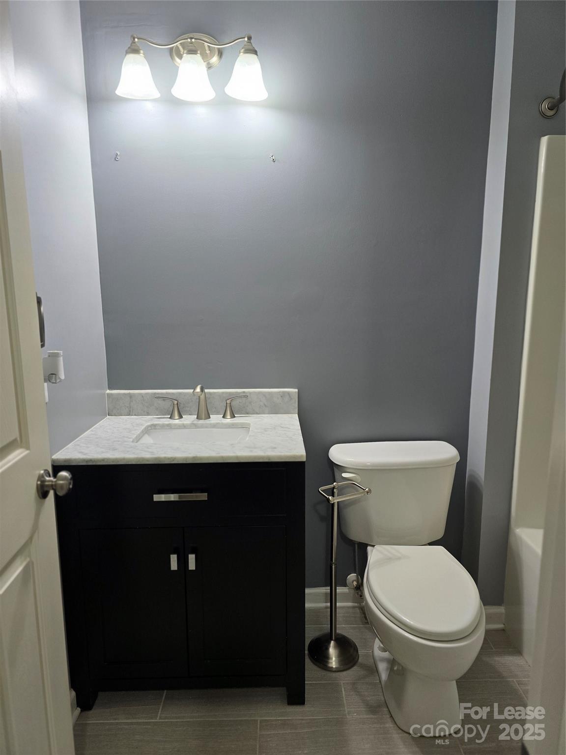 19025 Coachmans Trace Cornelius, NC 28031 - Photo 26 of 34 a bathroom with a sink and a toilet