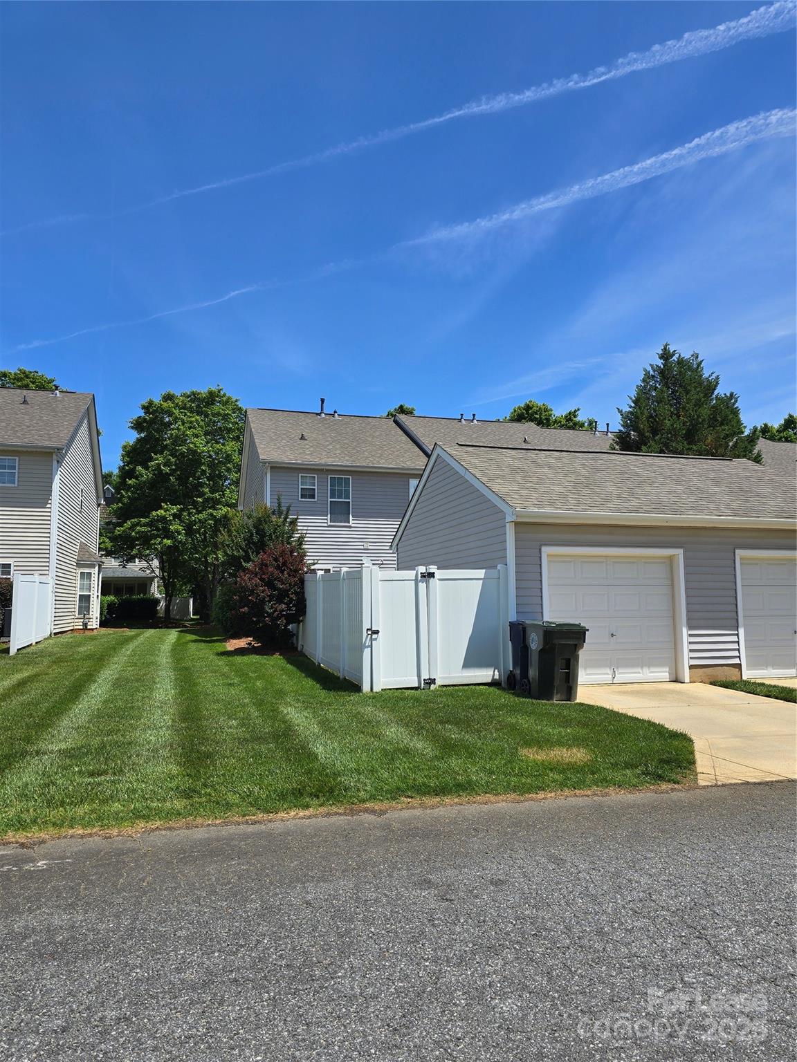 19025 Coachmans Trace Cornelius, NC 28031 - Photo 28 of 34 a view of a house with a yard and a car parked in front of it