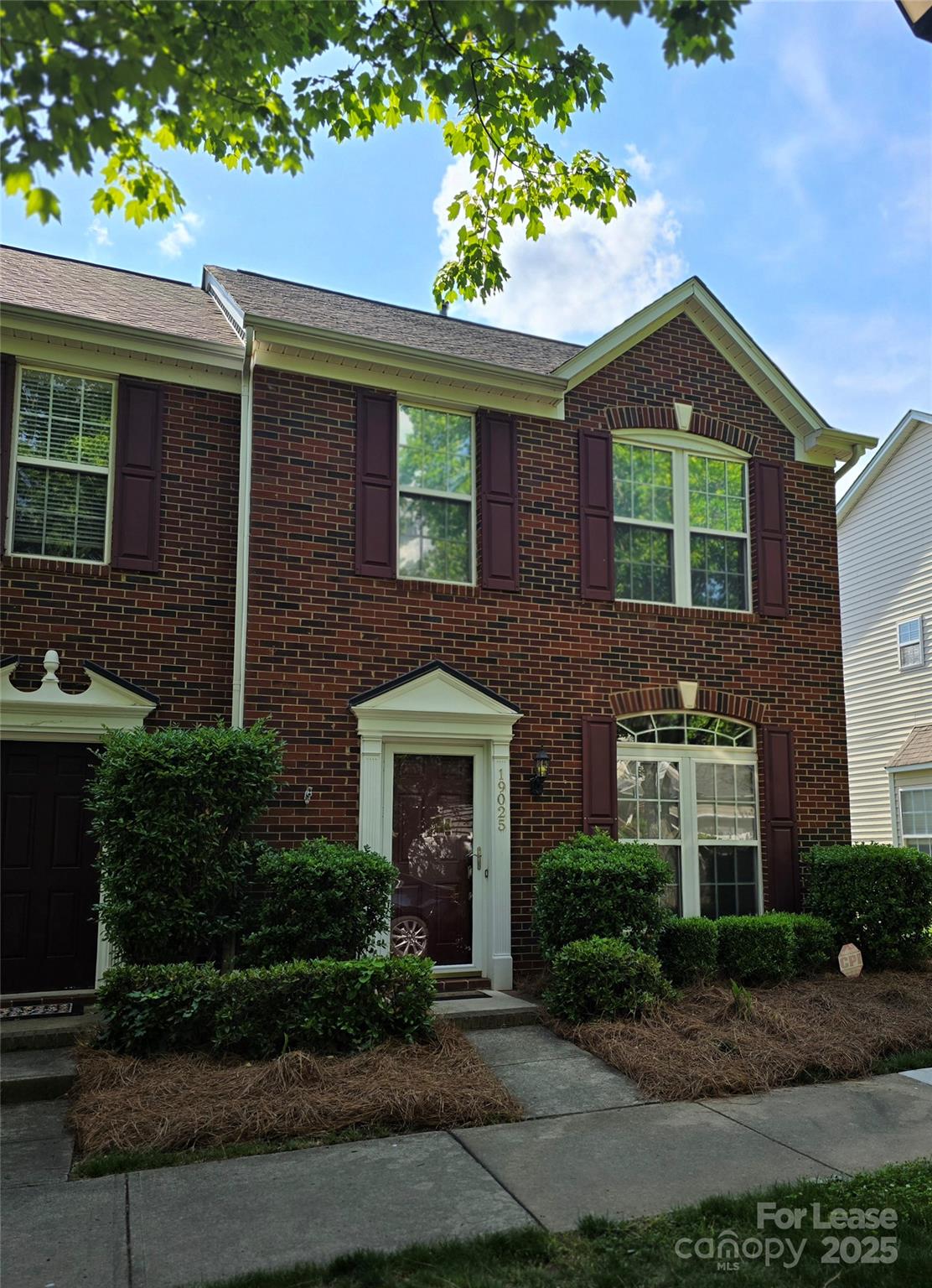 19025 Coachmans Trace Cornelius, NC 28031 - Photo 3 of 34 a front view of a house with garden