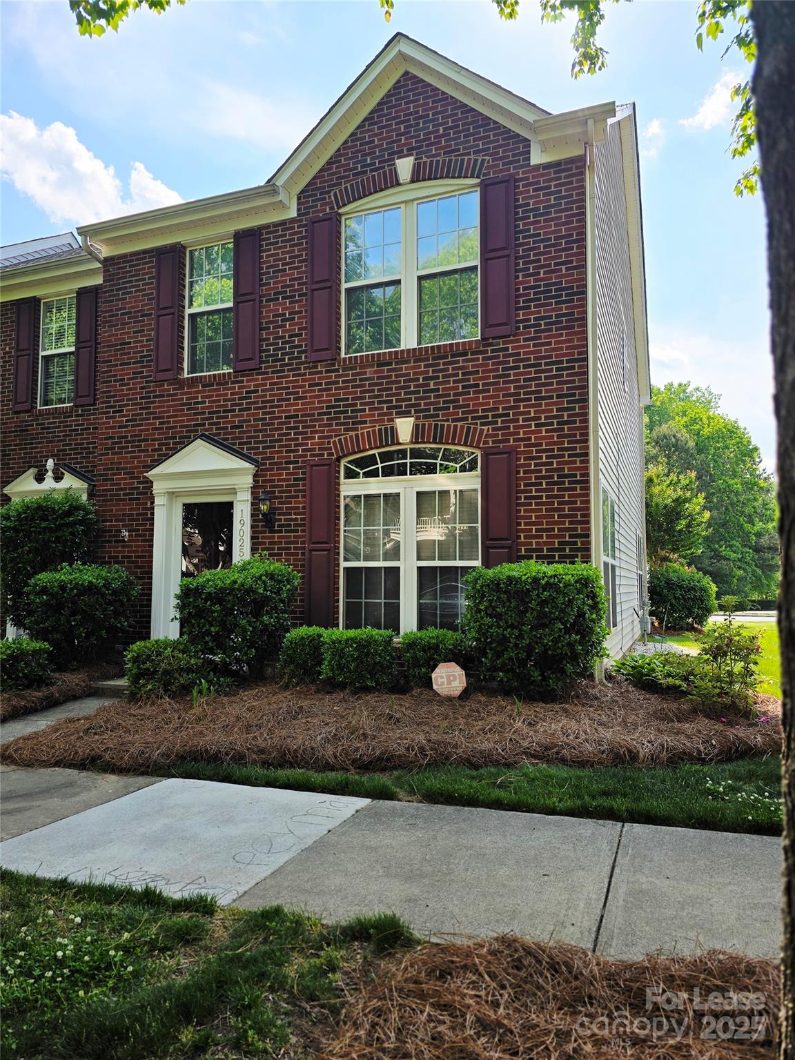 19025 Coachmans Trace Cornelius, NC 28031 - Photo 4 of 34 a front view of a house with garden