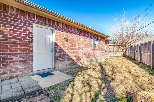 a bathroom with double sink and a mirror