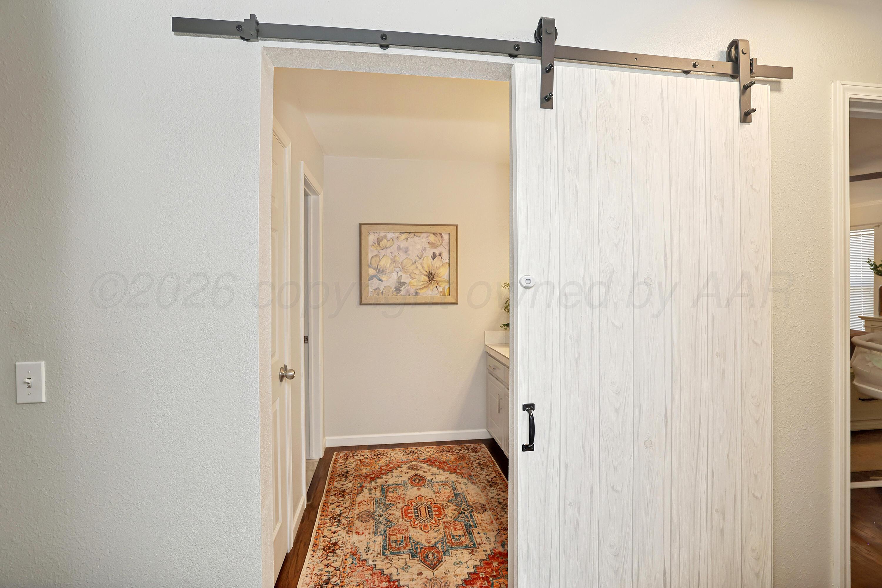 7809 Cervin Drive Amarillo, TX 79121 - Photo 16 of 32 16-Bathroom Barn Door