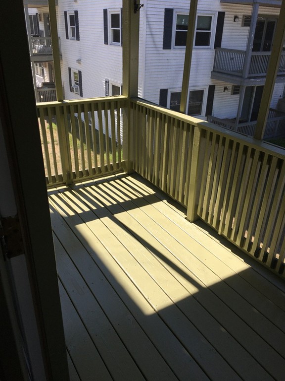 30 Abbey Road, Unit 202 Leominster, MA 01453 - Photo 5 of 10 a view of balcony with wooden floor