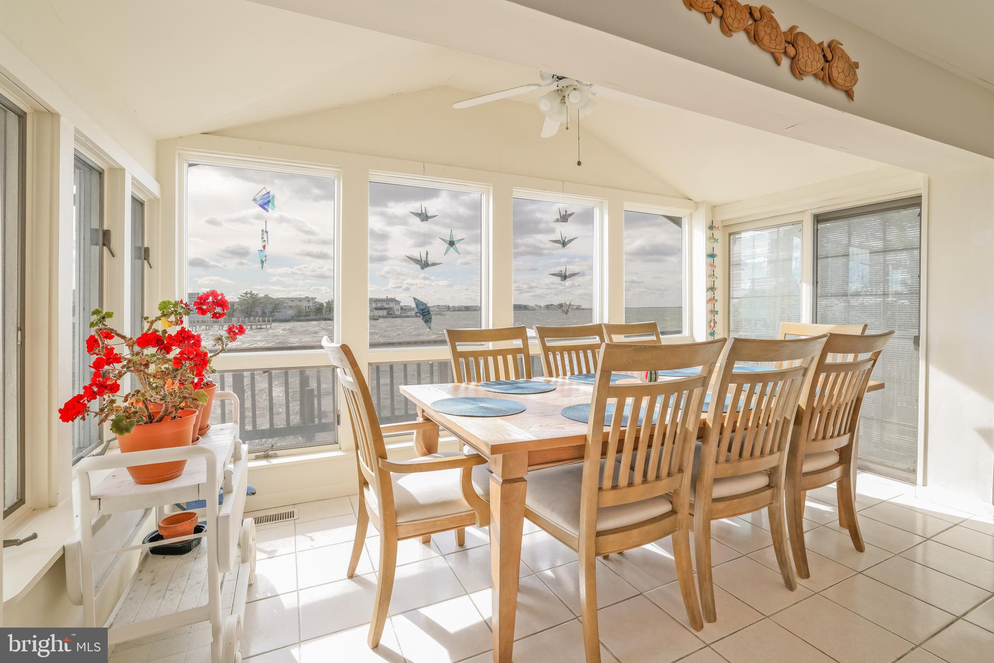 24 Maiden Lane Harvey Cedars, NJ 08008 - Photo 14 of 37 a view of a dining room with furniture and chandelier
