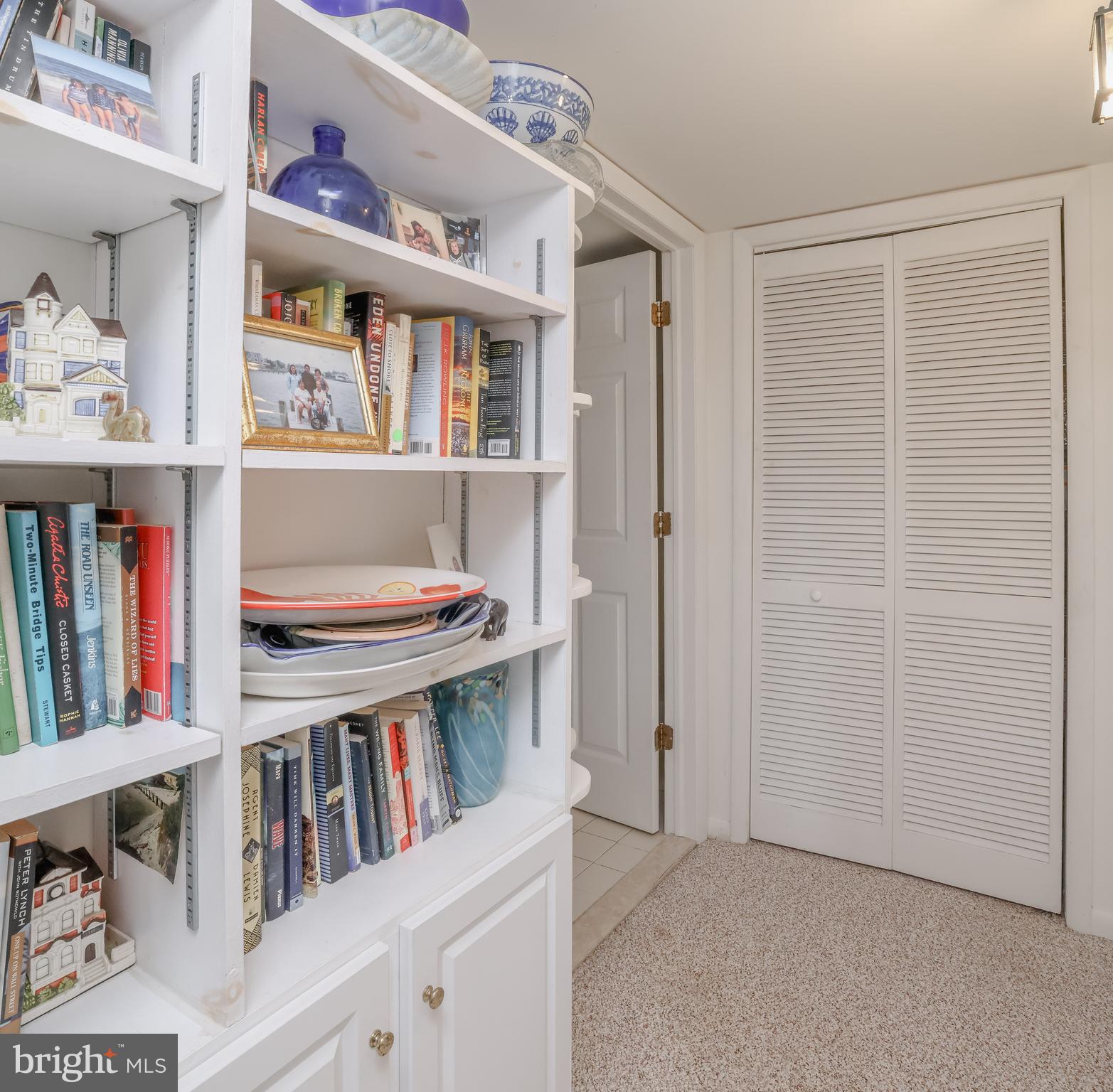 24 Maiden Lane Harvey Cedars, NJ 08008 - Photo 16 of 37 a view of an empty room with shelves