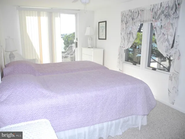 a bathroom with a toilet and a shower curtain