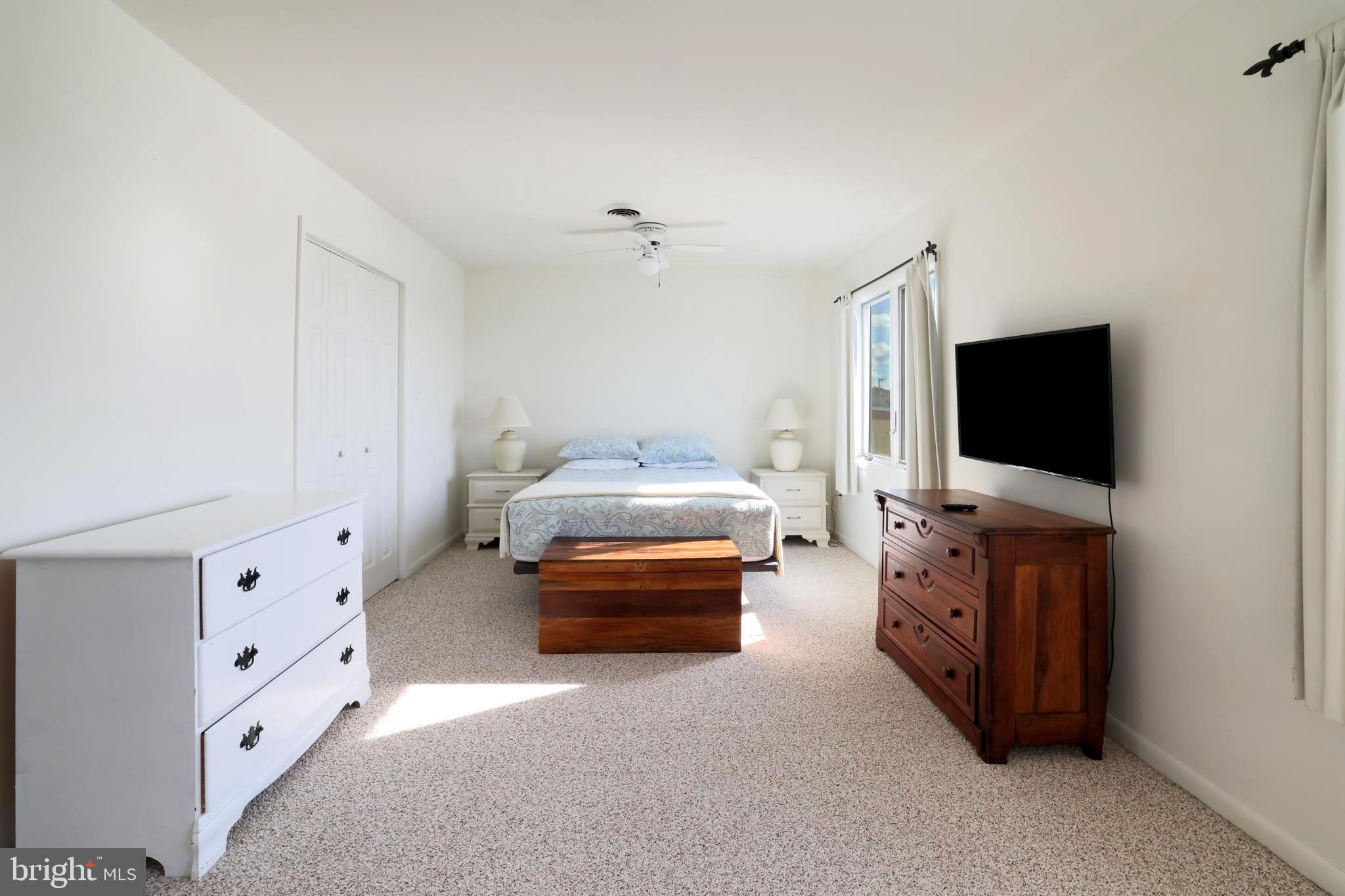 24 Maiden Lane Harvey Cedars, NJ 08008 - Photo 25 of 37 a living room with furniture and a flat screen tv