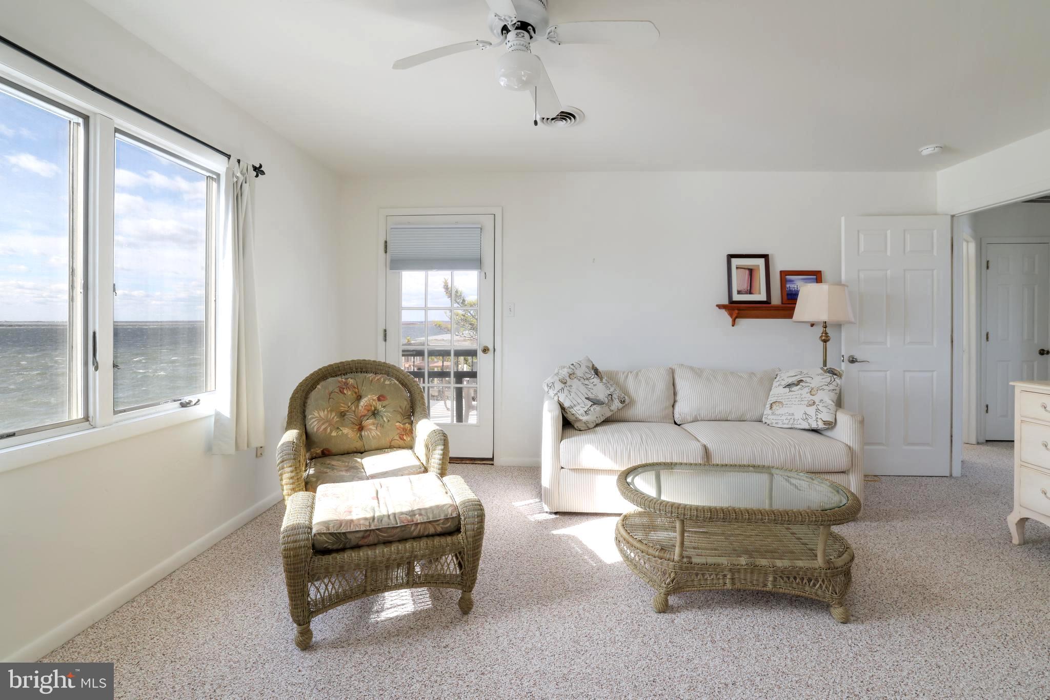 24 Maiden Lane Harvey Cedars, NJ 08008 - Photo 27 of 37 a living room with furniture and a window